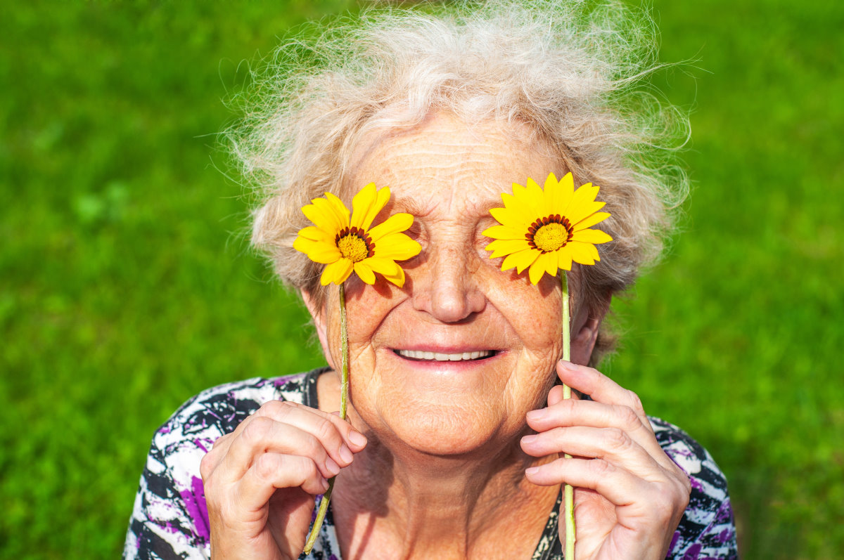 Foto Frau mit SOnnenblume